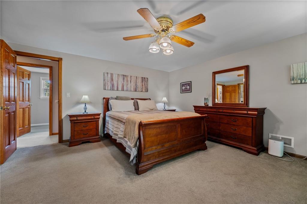 2387 Harrison City Road Export, PA 15632 - Photo 31 of 48 a bedroom with a bed and a chandelier