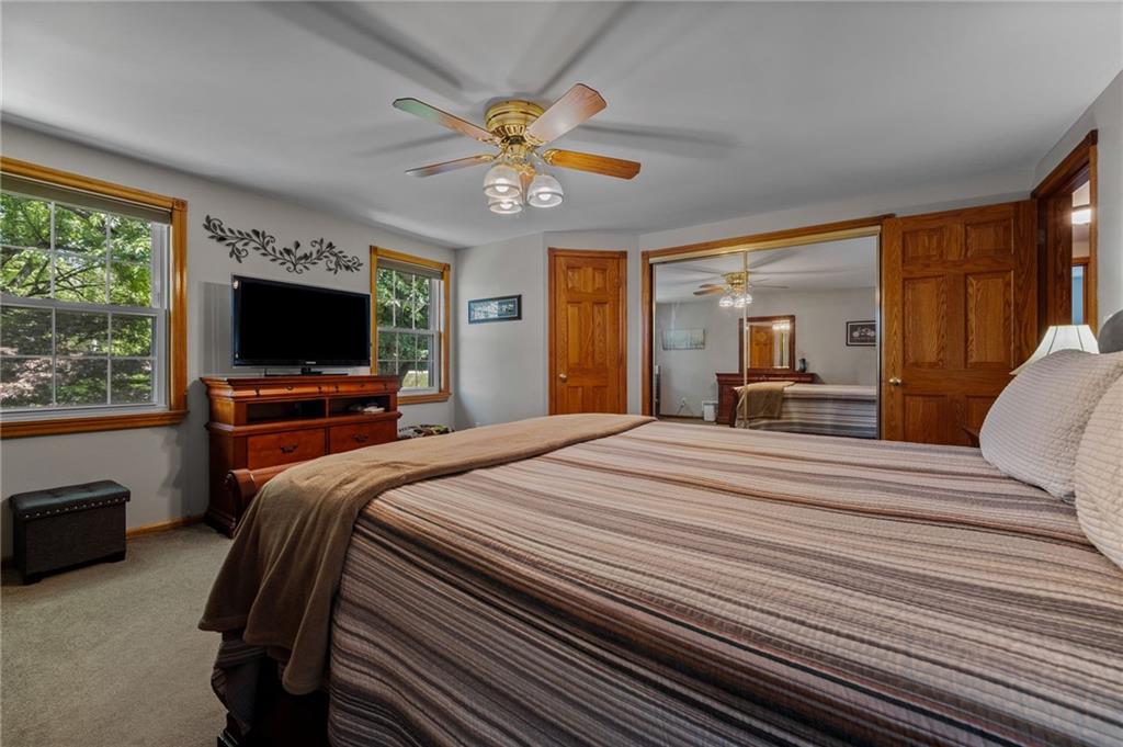 2387 Harrison City Road Export, PA 15632 - Photo 32 of 48 a bedroom with a bed and a chandelier