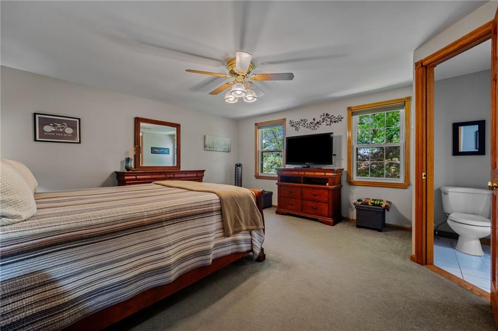 2387 Harrison City Road Export, PA 15632 - Photo 33 of 48 a bedroom with a bed and a tv