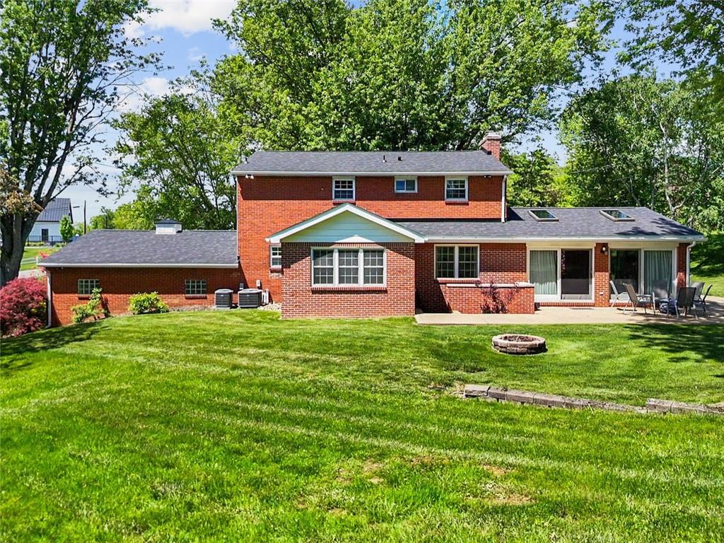 2387 Harrison City Road Export, PA 15632 - Photo 45 of 48 a front view of a house with a yard table and chairs