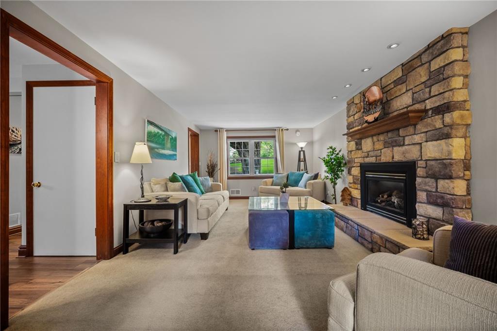 2387 Harrison City Road Export, PA 15632 - Photo 9 of 48 a living room with furniture and a fireplace