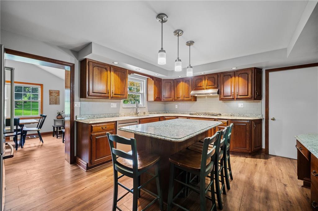 2387 Harrison City Road Export, PA 15632 - Photo 10 of 48 a view of a dining room with furniture window and wooden floor