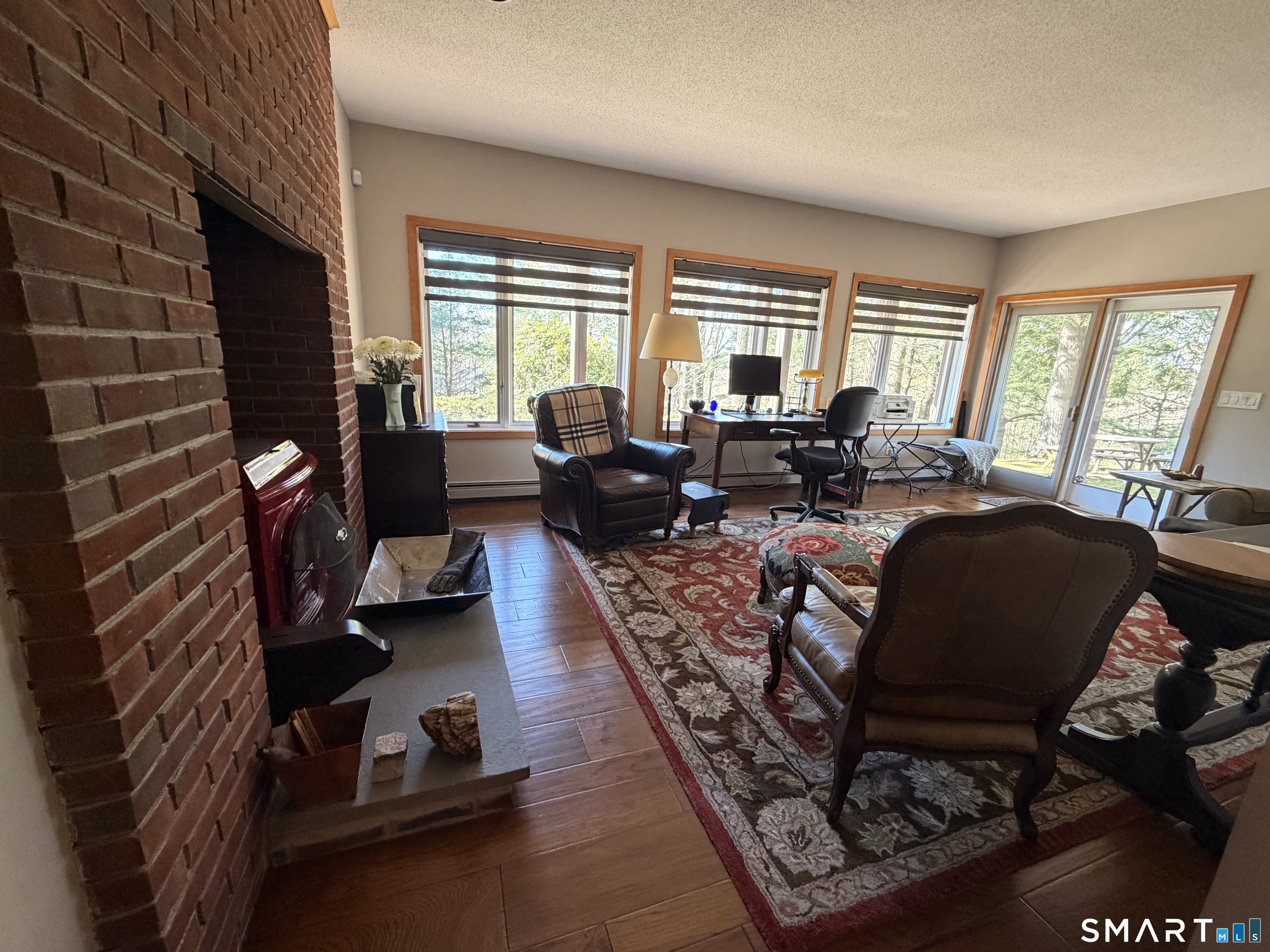 86 Washburn Road Canton, CT 06019 - Photo 14 of 40 a living room with furniture and a fireplace