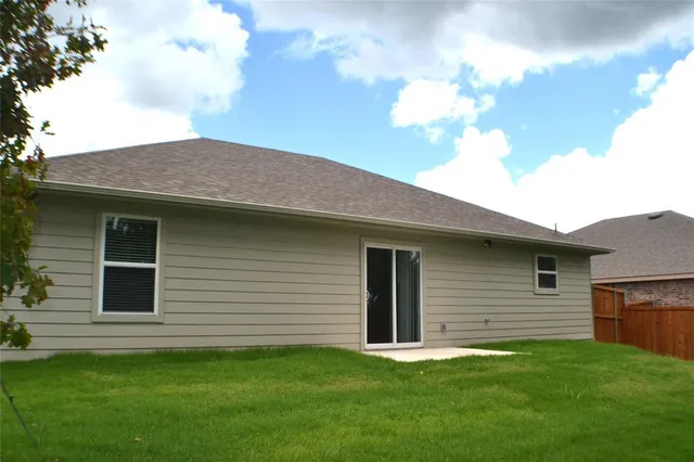 a backyard of a house with lots of green space