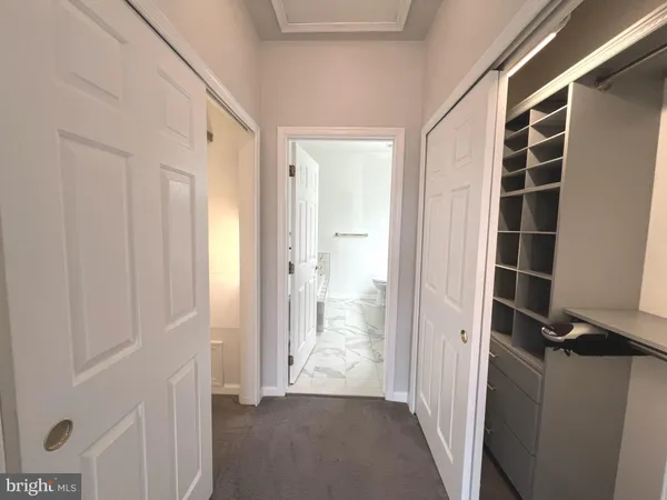 a view of front door with wooden floor