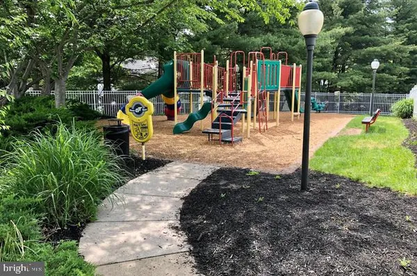 a view of a park with slide and a slide