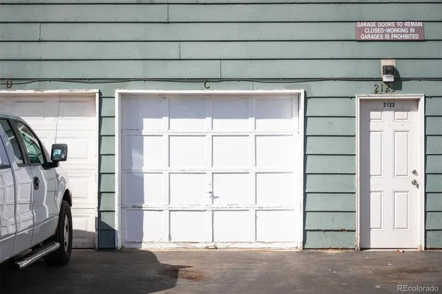 a view of a porch with wooden floor and iron stairs