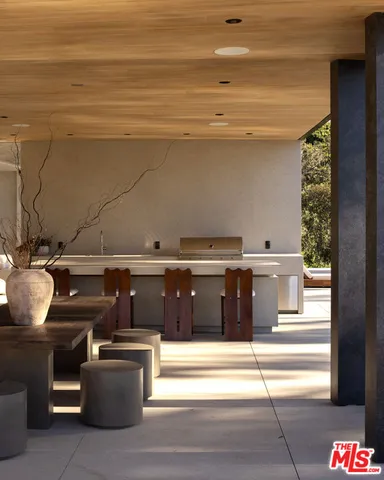 a bedroom with furniture and large windows