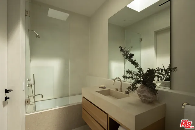 a room with gym equipment and view of living room