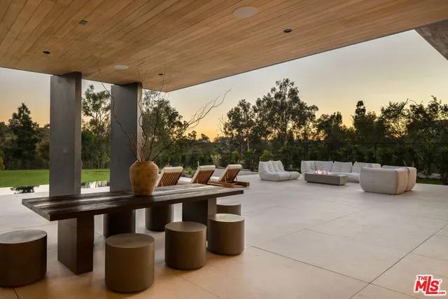 a view of a swimming pool with chairs