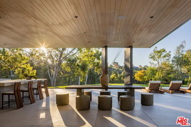 a view of a house with swimming pool yard and sitting area