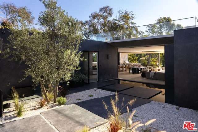 a view of a glass door with glass windows