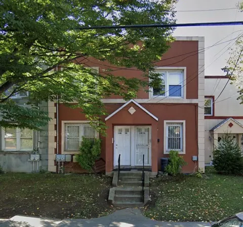 front view of a house with a yard