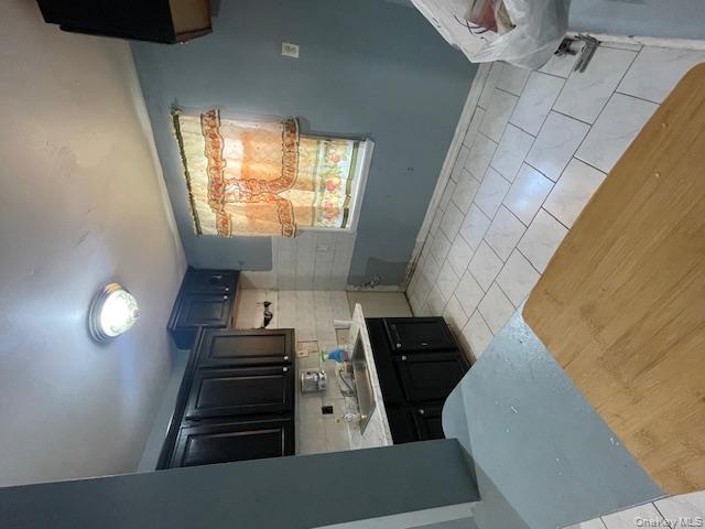 140-36 184th Street Queens, NY 11413 - Photo 14 of 15 a kitchen with a sink and a stove top oven