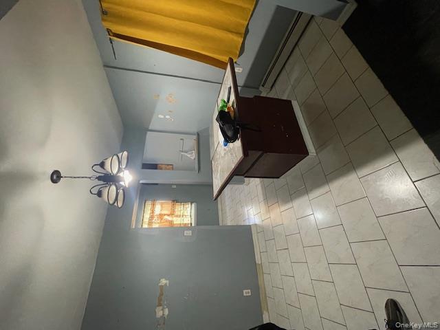 140-36 184th Street Queens, NY 11413 - Photo 7 of 15 a kitchen with stainless steel appliances granite countertop a sink and a stove