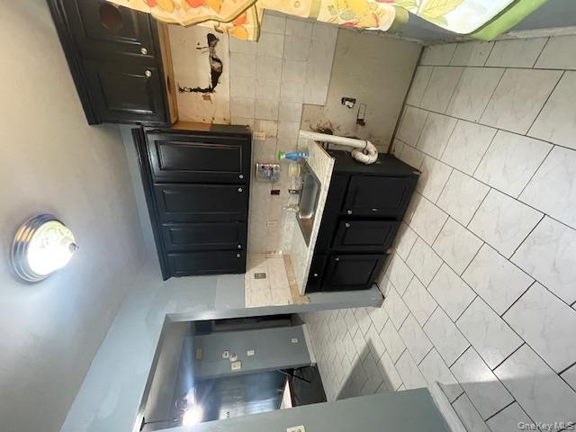 140-36 184th Street Queens, NY 11413 - Photo 8 of 15 a kitchen with a sink and cabinets