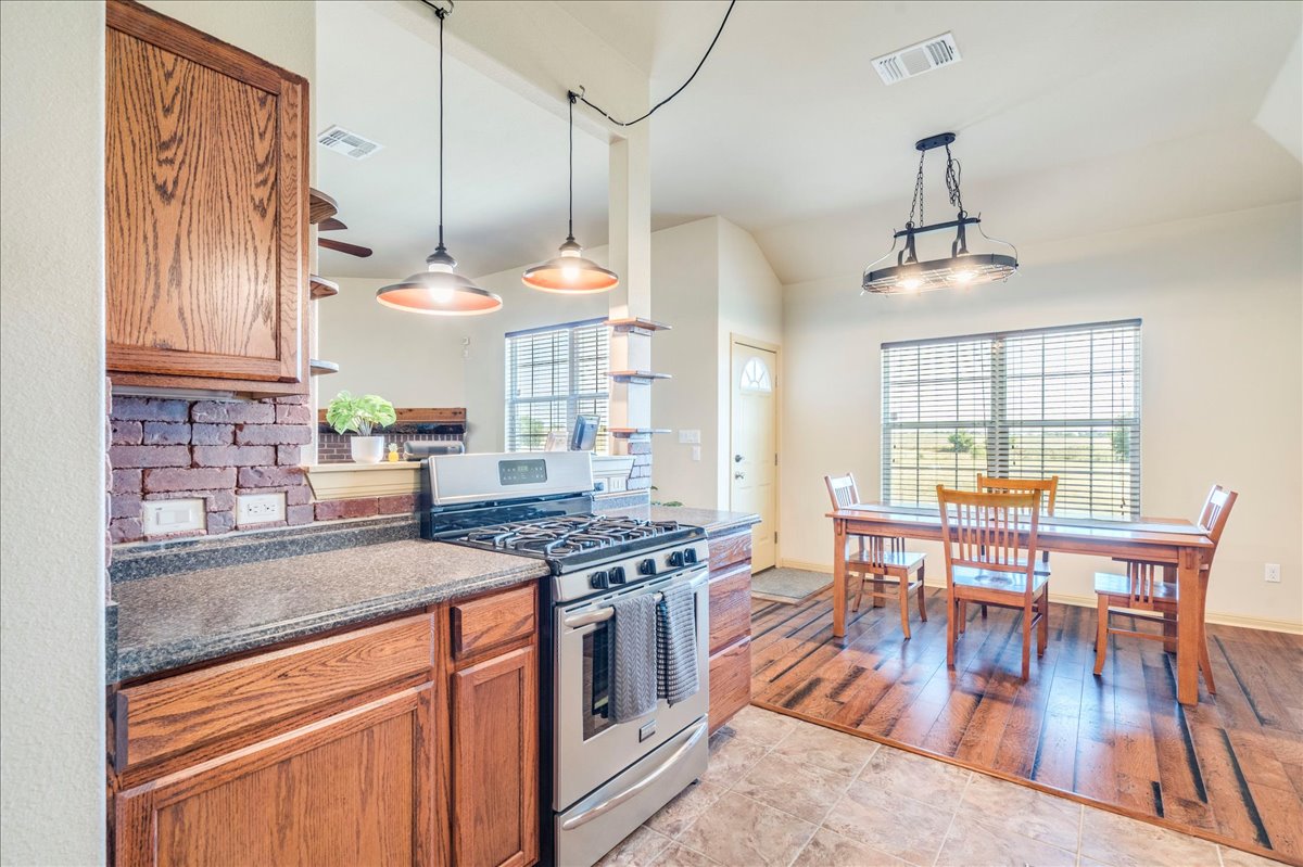 909 County Road 342 Granger, TX 76530 - Photo 17 of 37 Kitchen featuring stainless steel appliances, open to the family room