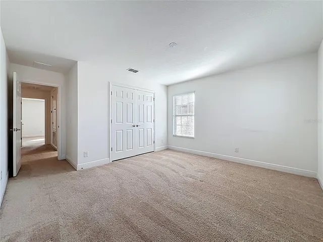 a white toilet sitting next to a bath tub