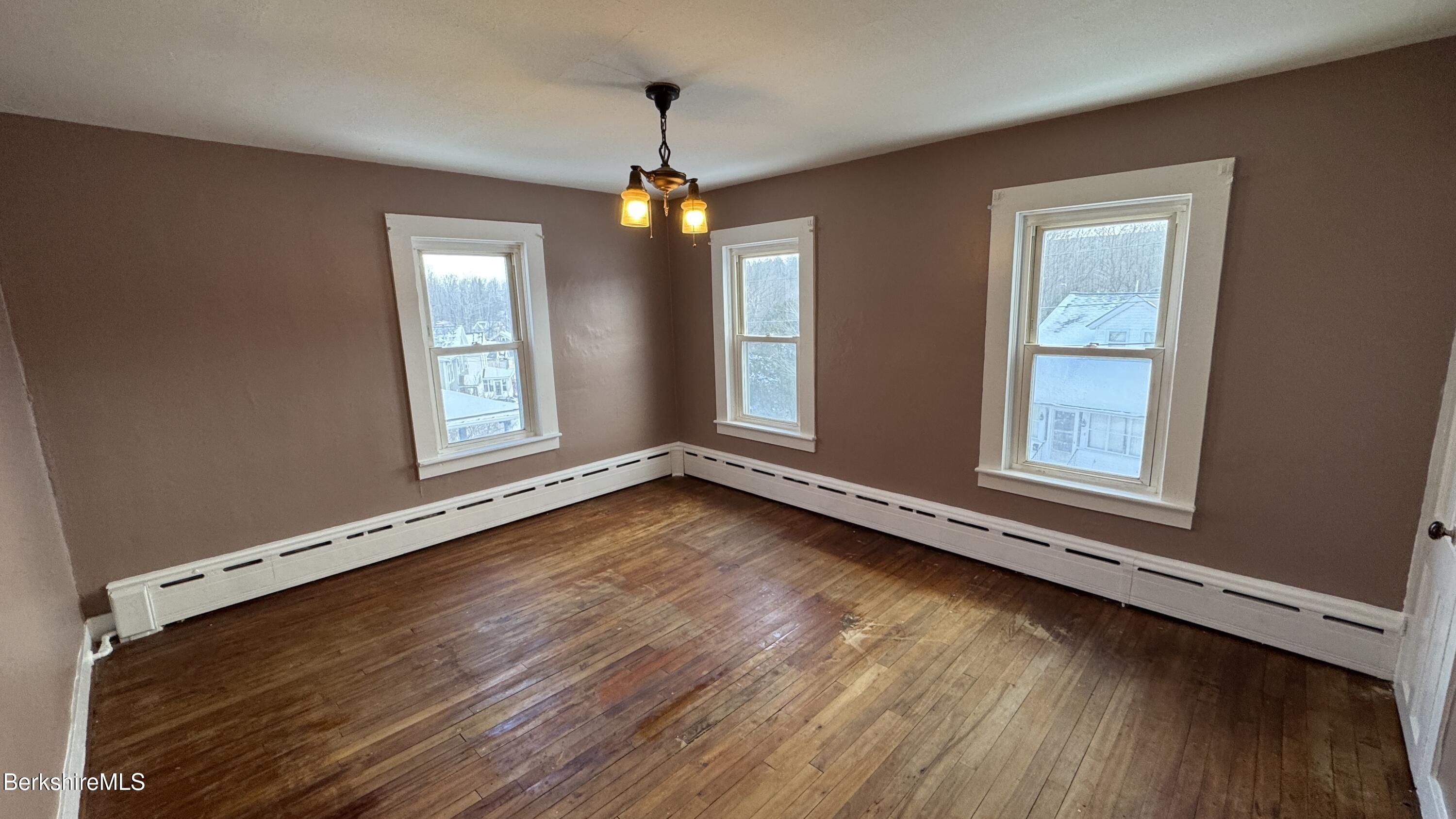 21 Enterprise Street Adams, MA 01220 - Photo 17 of 31 a view of an empty room with wooden floor and a window