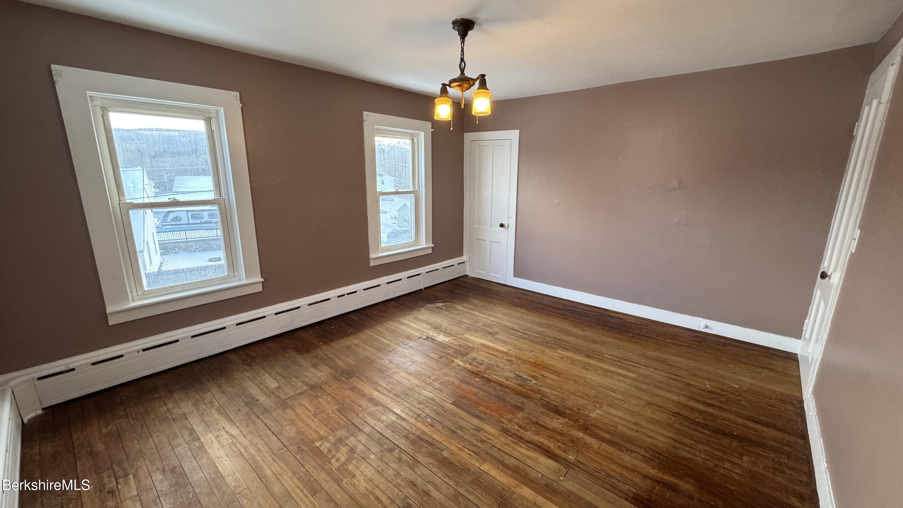 21 Enterprise Street Adams, MA 01220 - Photo 20 of 31 a view of an empty room with wooden floor and a window