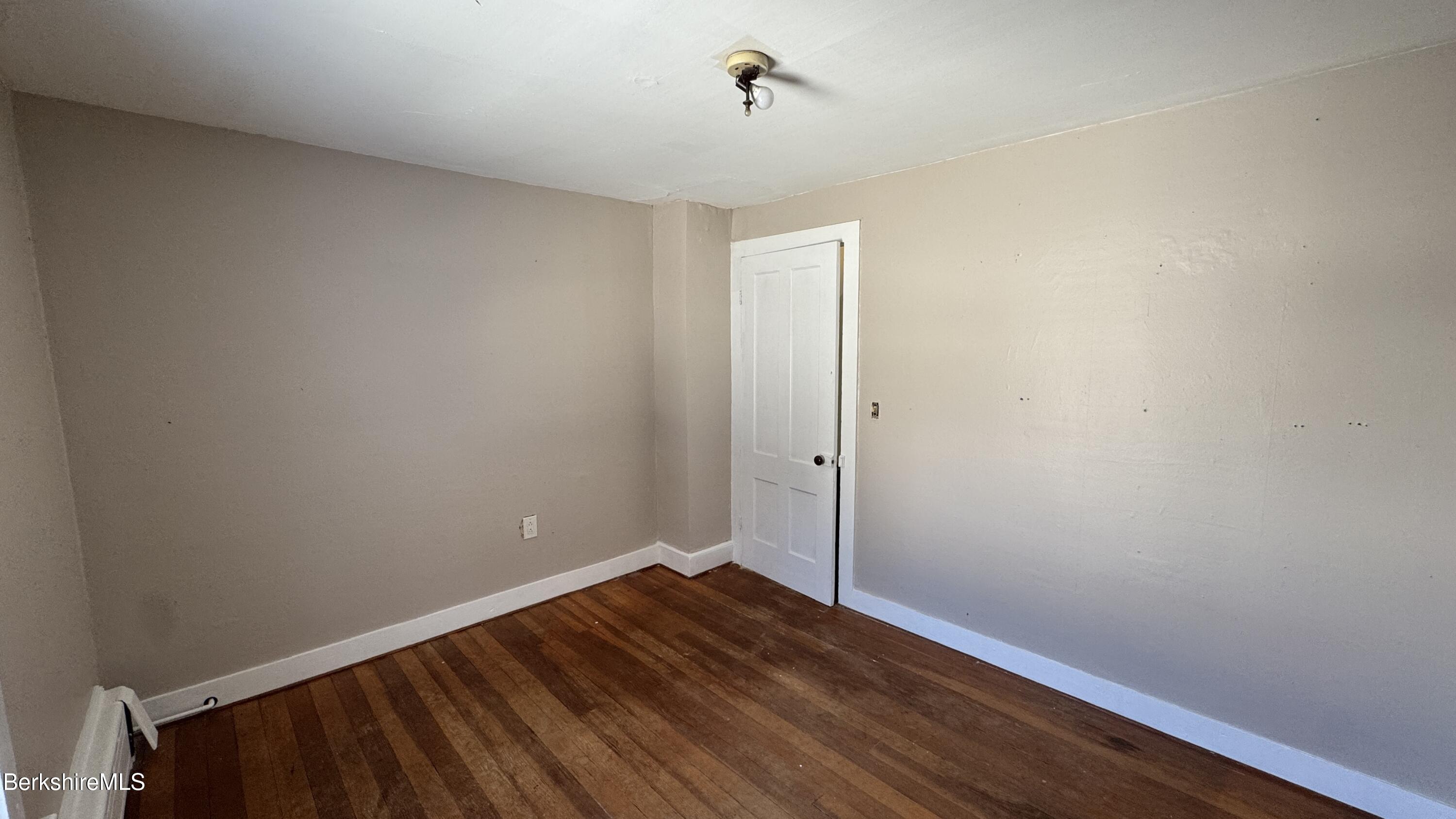 21 Enterprise Street Adams, MA 01220 - Photo 21 of 31 a view of an empty room with wooden floor