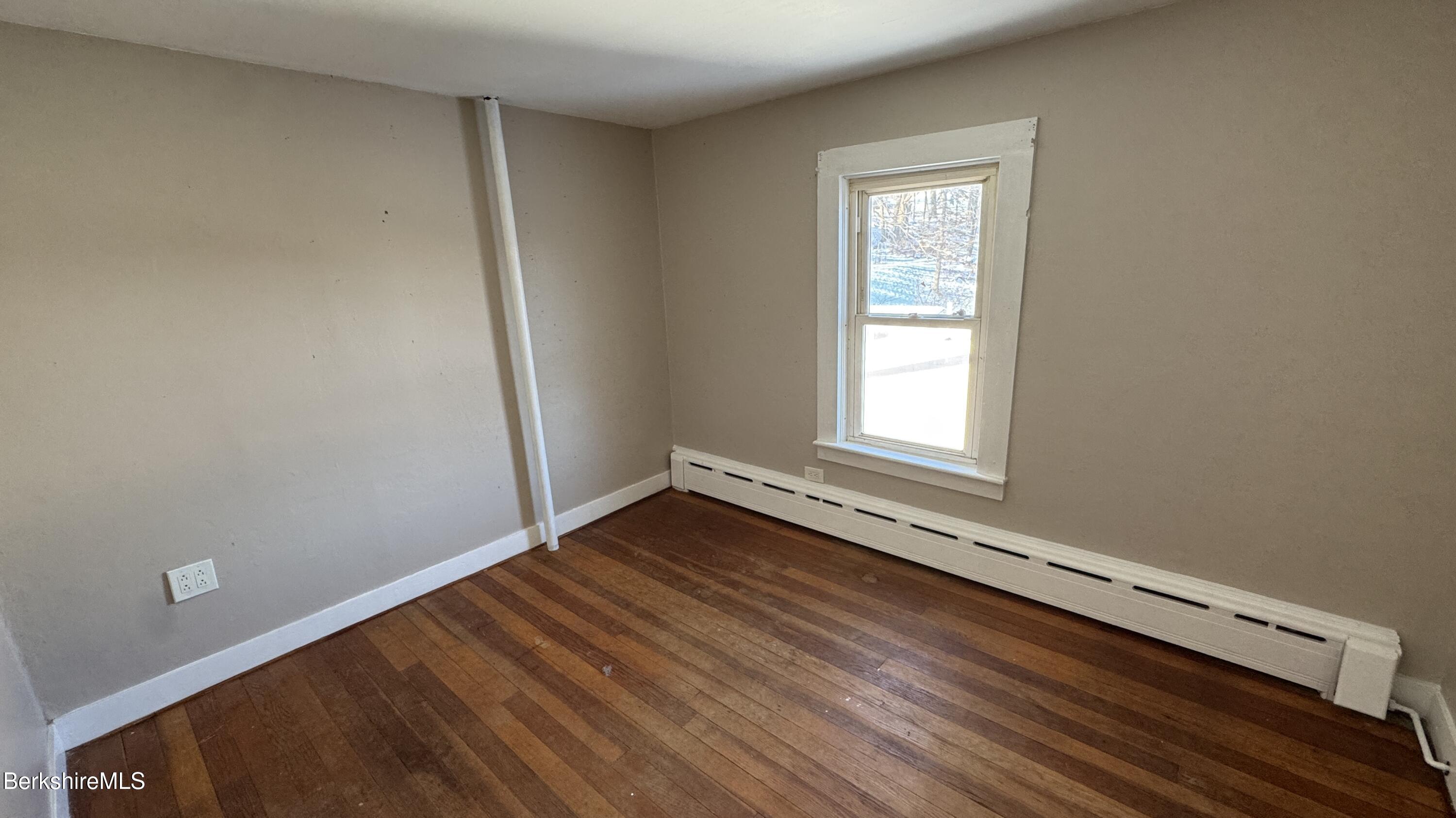 21 Enterprise Street Adams, MA 01220 - Photo 22 of 31 a view of a room with wooden floor and window
