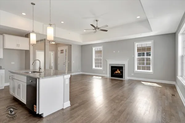 a view of a kitchen with a stove cabinets and wooden floor
