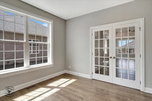 a view of empty room with windows