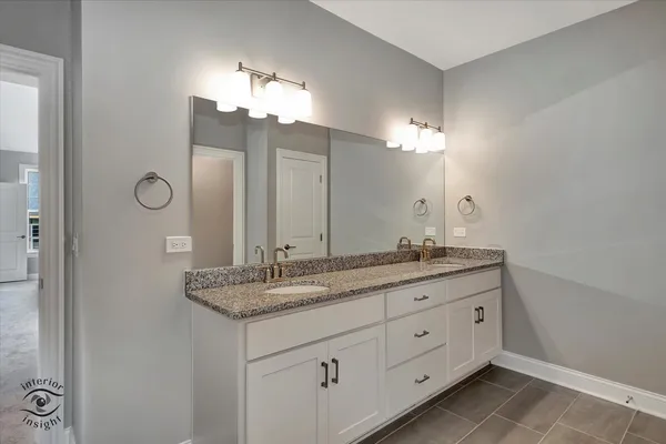 a view of a bathroom with a glass door shower
