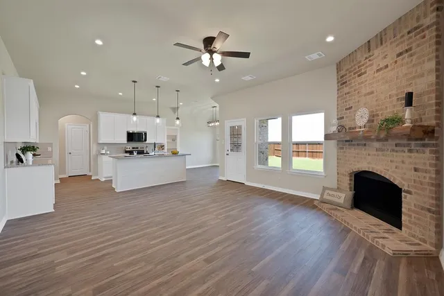 a view of kitchen with sink and wooden floor