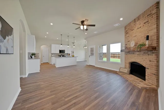 a view of kitchen and hall with wooden floor