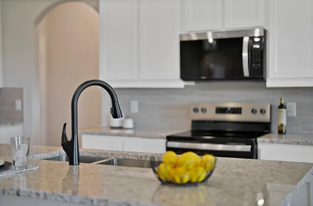 a kitchen with a stove and a microwave