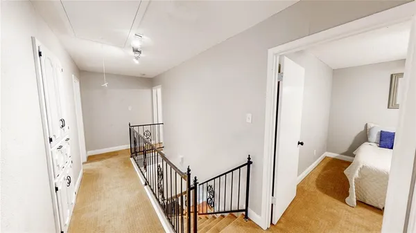 a bedroom with a bed and a ceiling fan