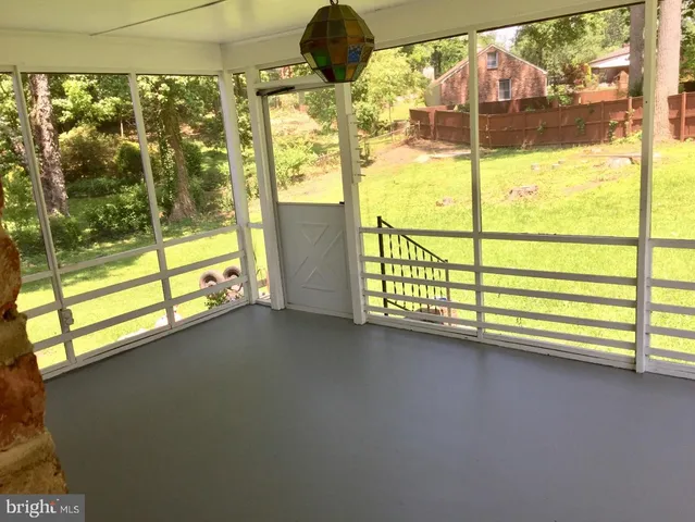 a view of a floor to ceiling window in an empty room