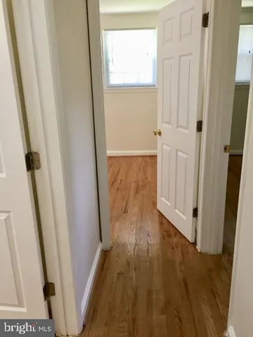 a view of front door with wooden floor
