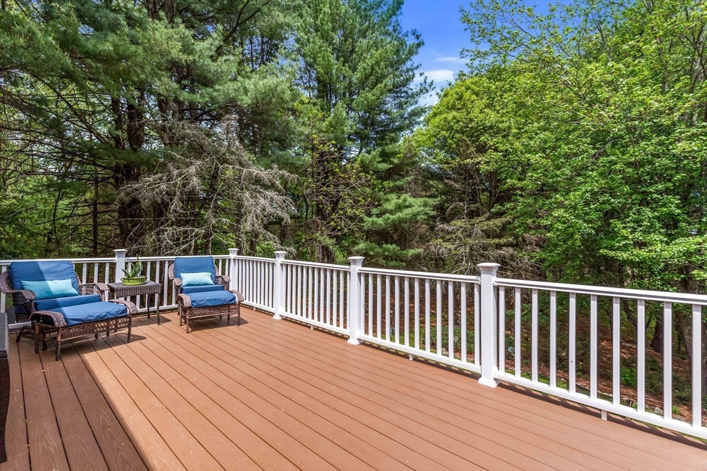 15 Conestoga Road Lexington, MA 02421 - Photo 26 of 31 a view of a wooden deck with chairs