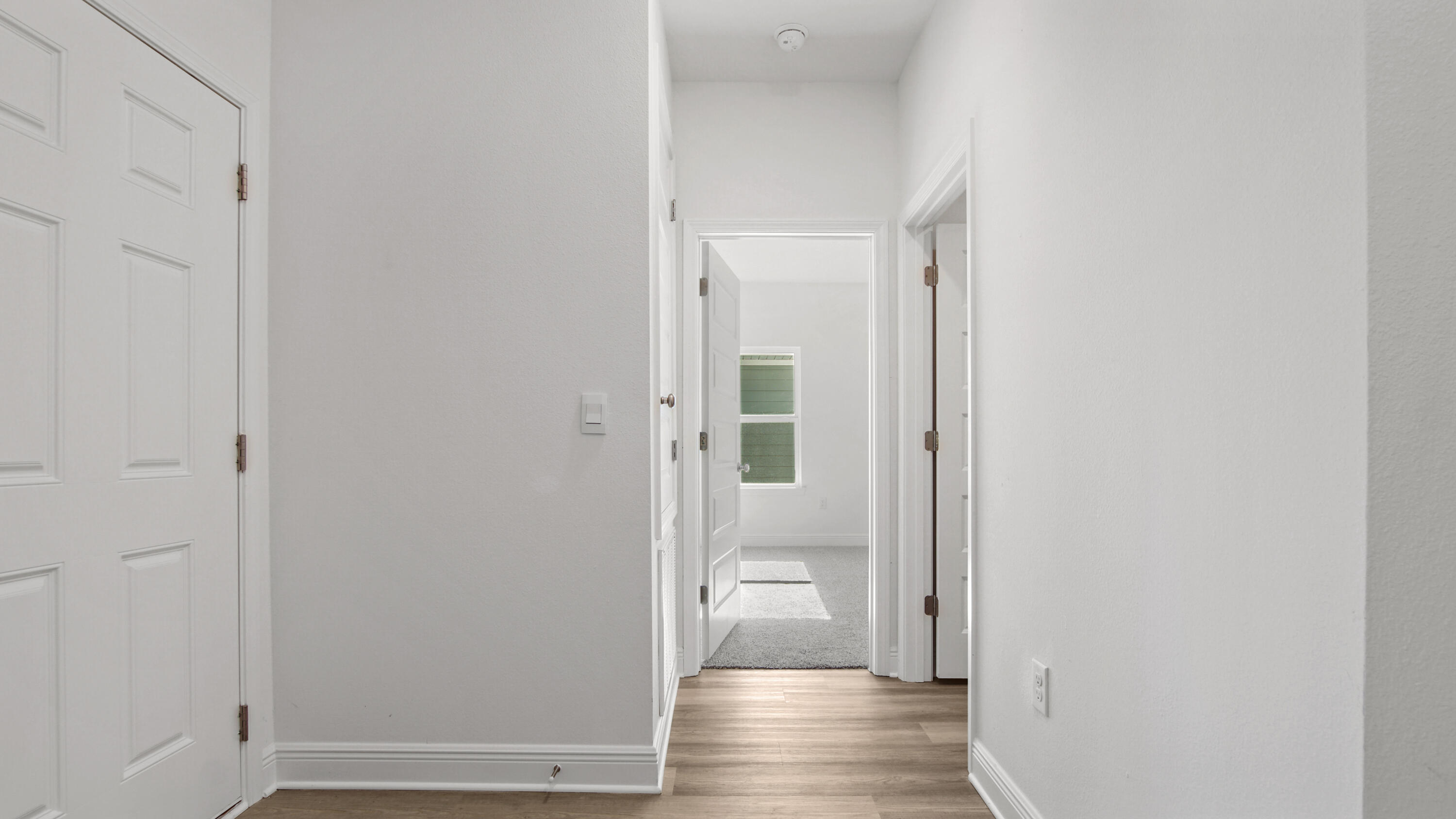 39 Gray Owl Drive Freeport, FL 32439 - Photo 27 of 31 a view of a hallway with wooden floor