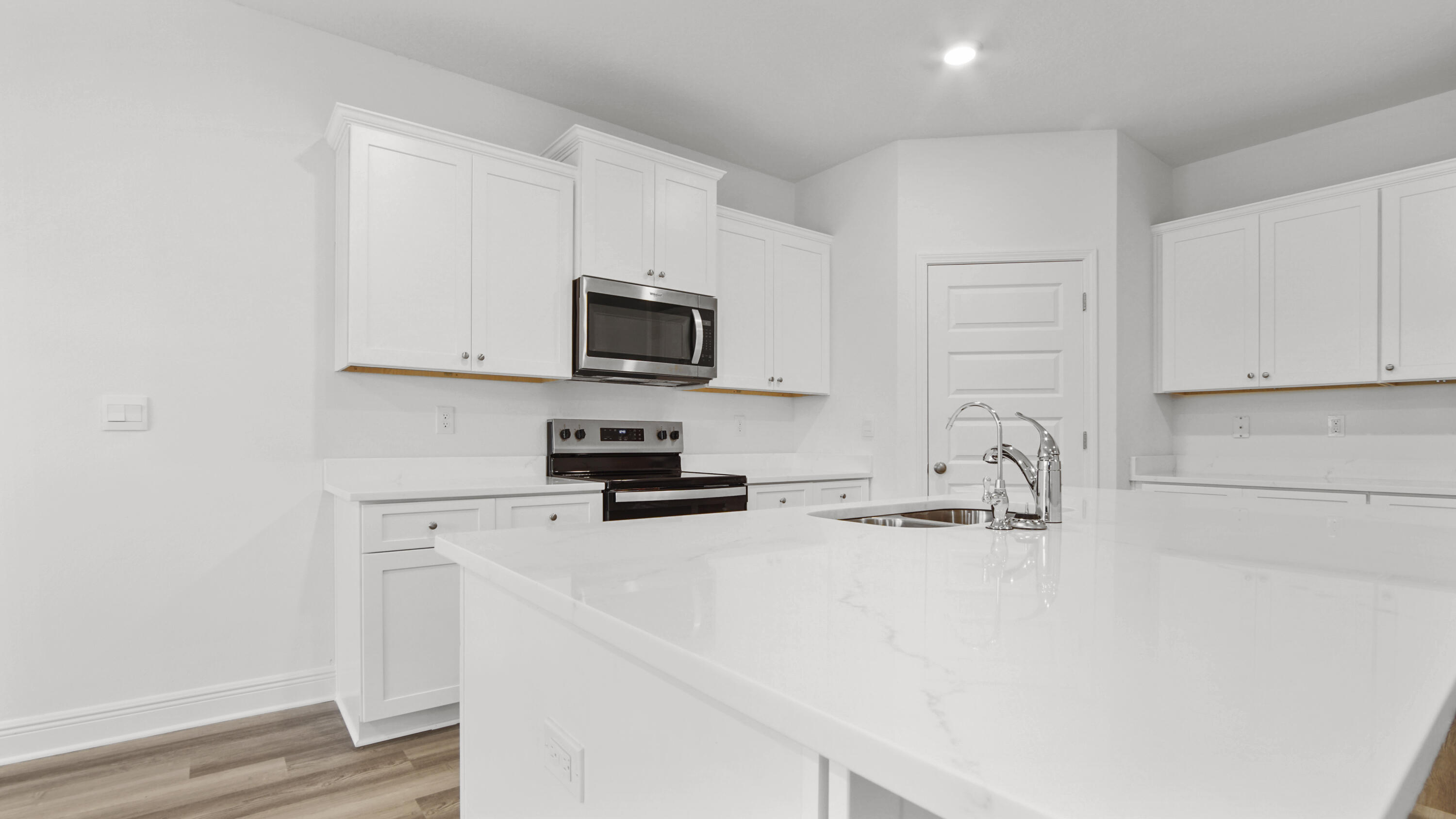 39 Gray Owl Drive Freeport, FL 32439 - Photo 9 of 31 a kitchen with a refrigerator a stove a microwave and cabinets