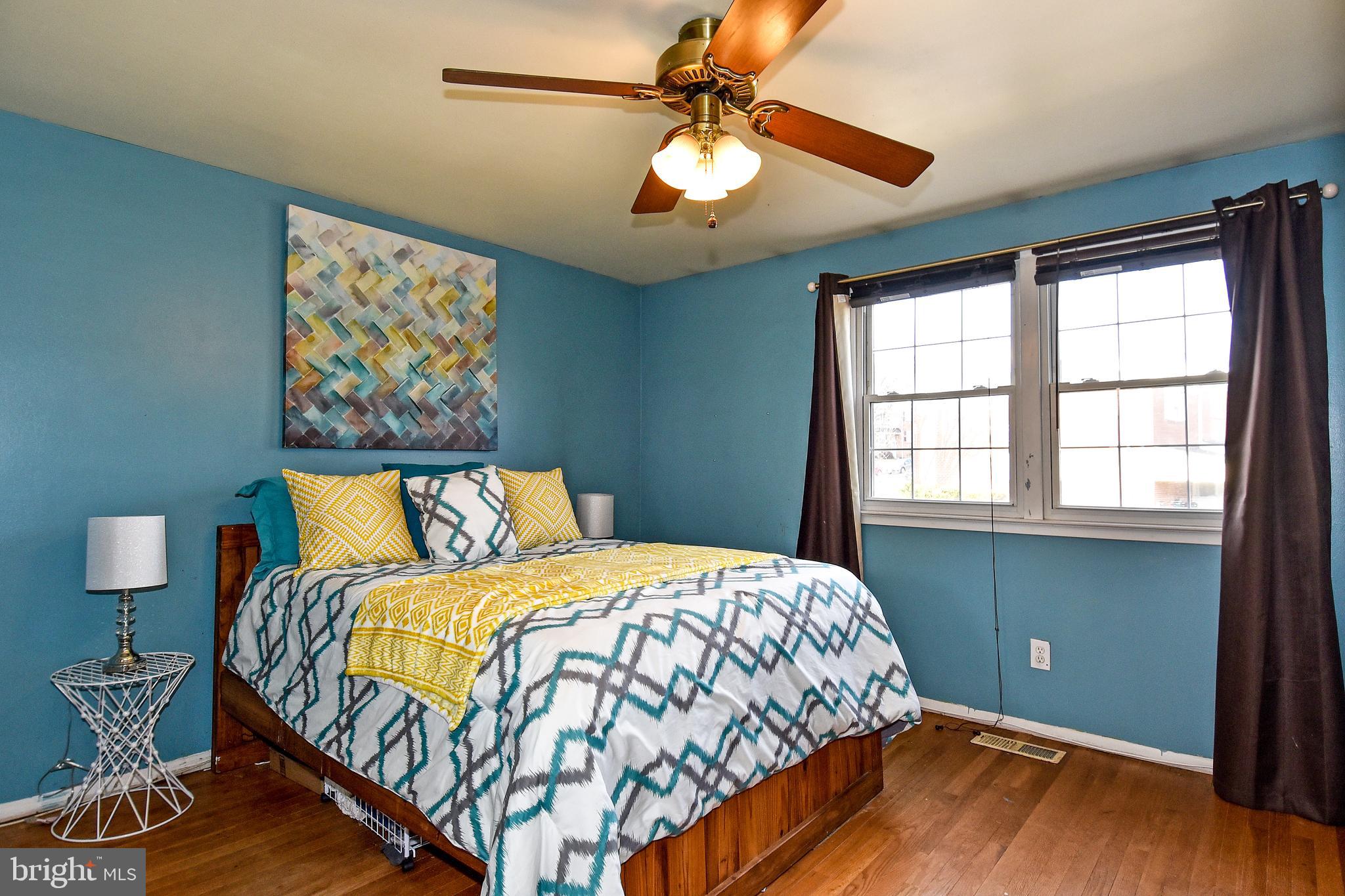 1024 Grovehill Road Baltimore, MD 21227 - Photo 17 of 39 a bedroom with a bed and a window