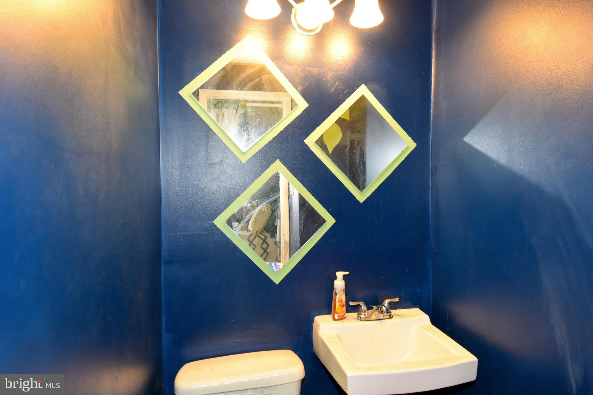 1024 Grovehill Road Baltimore, MD 21227 - Photo 21 of 39 a bathroom with a toilet and a sink