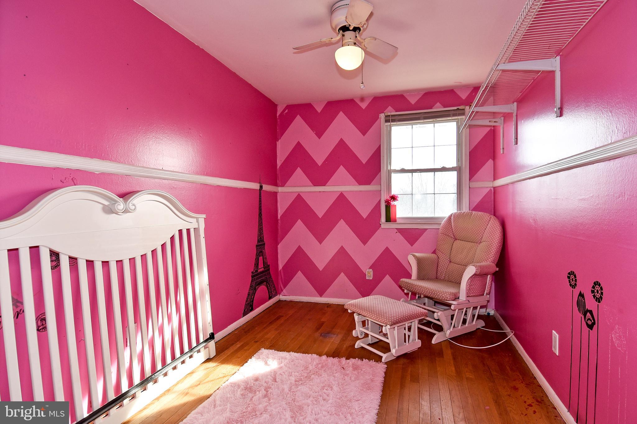 1024 Grovehill Road Baltimore, MD 21227 - Photo 25 of 39 a bed room with a bed and a chair