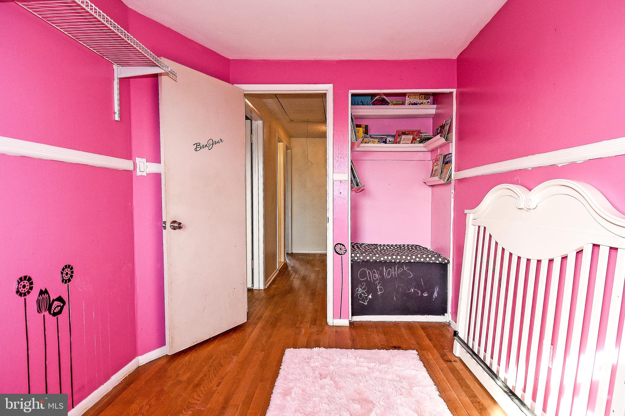 1024 Grovehill Road Baltimore, MD 21227 - Photo 26 of 39 a bedroom with a bed and a dresser
