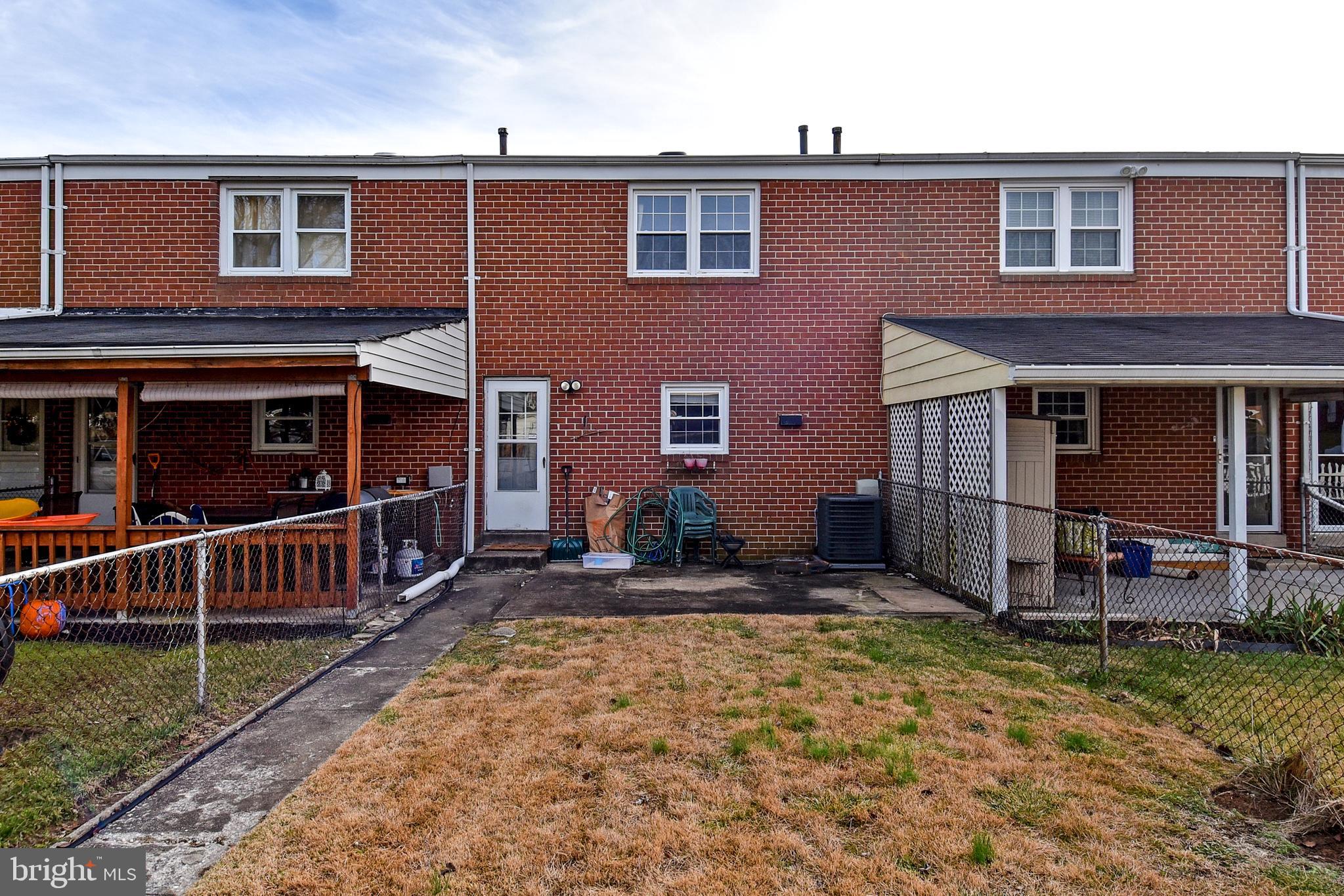 1024 Grovehill Road Baltimore, MD 21227 - Photo 37 of 39 a view front of house with a yard