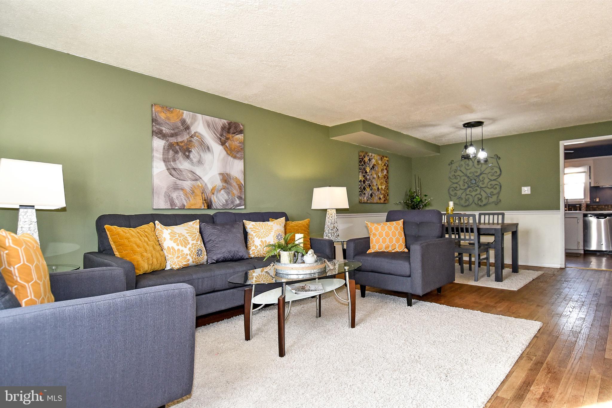 1024 Grovehill Road Baltimore, MD 21227 - Photo 5 of 39 a living room with furniture and wooden floor
