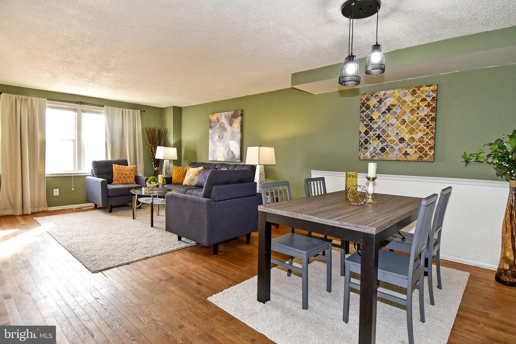 1024 Grovehill Road Baltimore, MD 21227 - Photo 10 of 39 a view of a dining room with furniture window and wooden floor