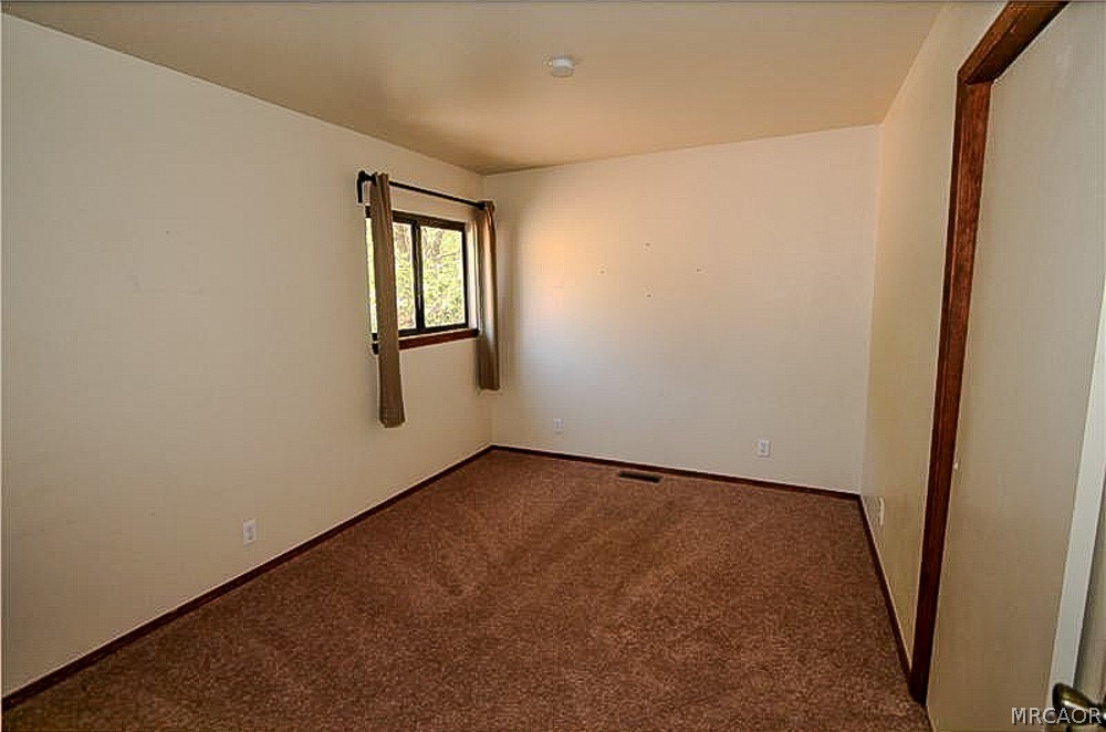 337 Maple Lane Sugarloaf, CA 92386 - Photo 18 of 25 a view of an empty room with window