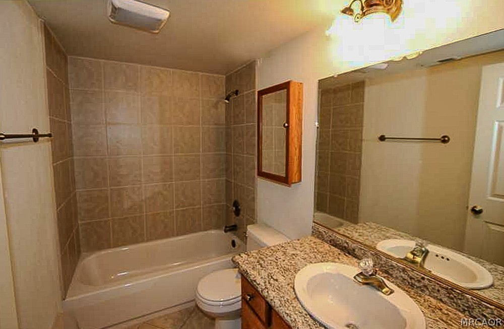 337 Maple Lane Sugarloaf, CA 92386 - Photo 22 of 25 a bathroom with a sink toilet and shower