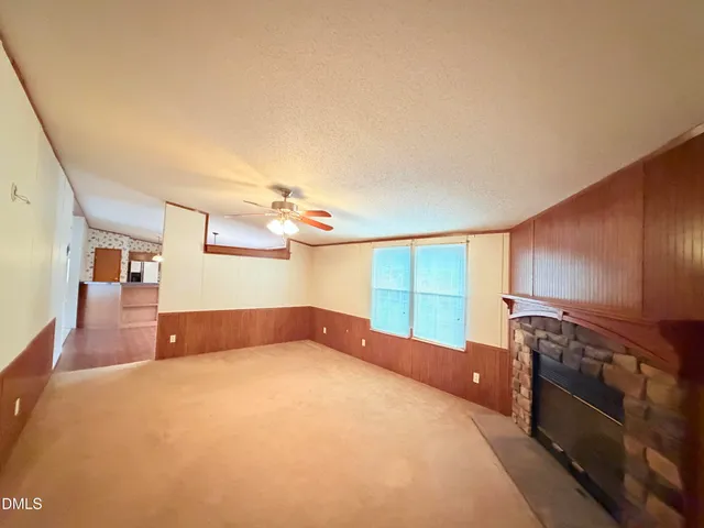 a bedroom with a bed and cabinets