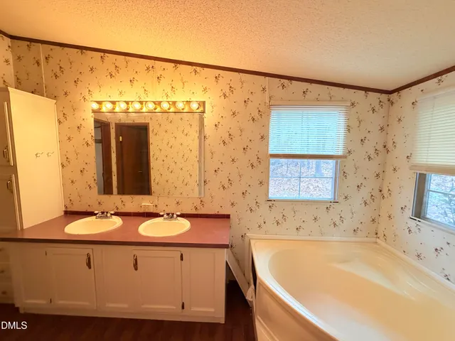 a bathroom with a bathtub and a sink