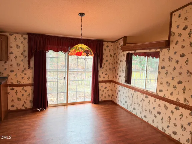 a view of an entryway with a floor to ceiling window